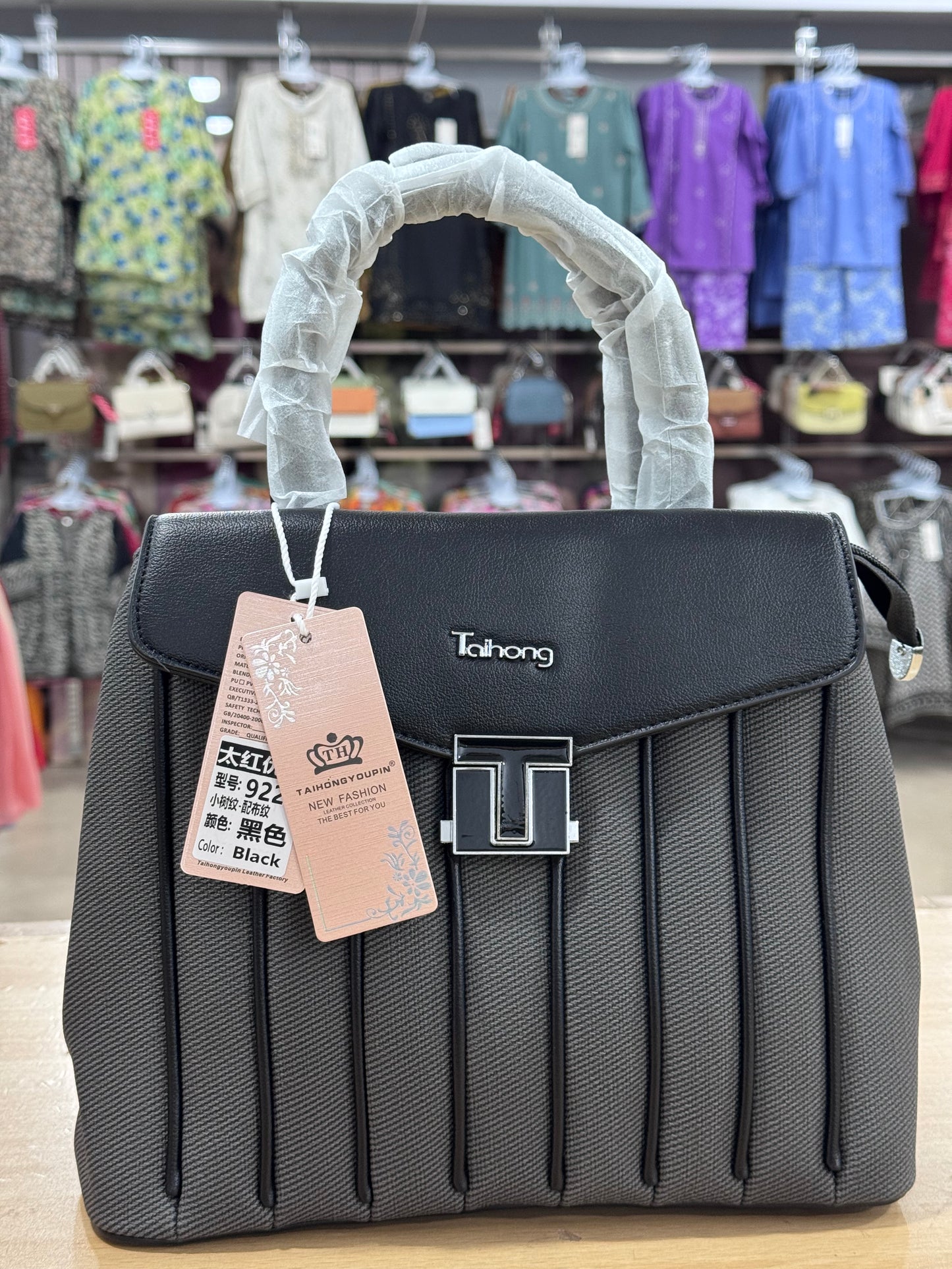 Elegant Structured Handbag with Adjustable Long Shoulder Strap