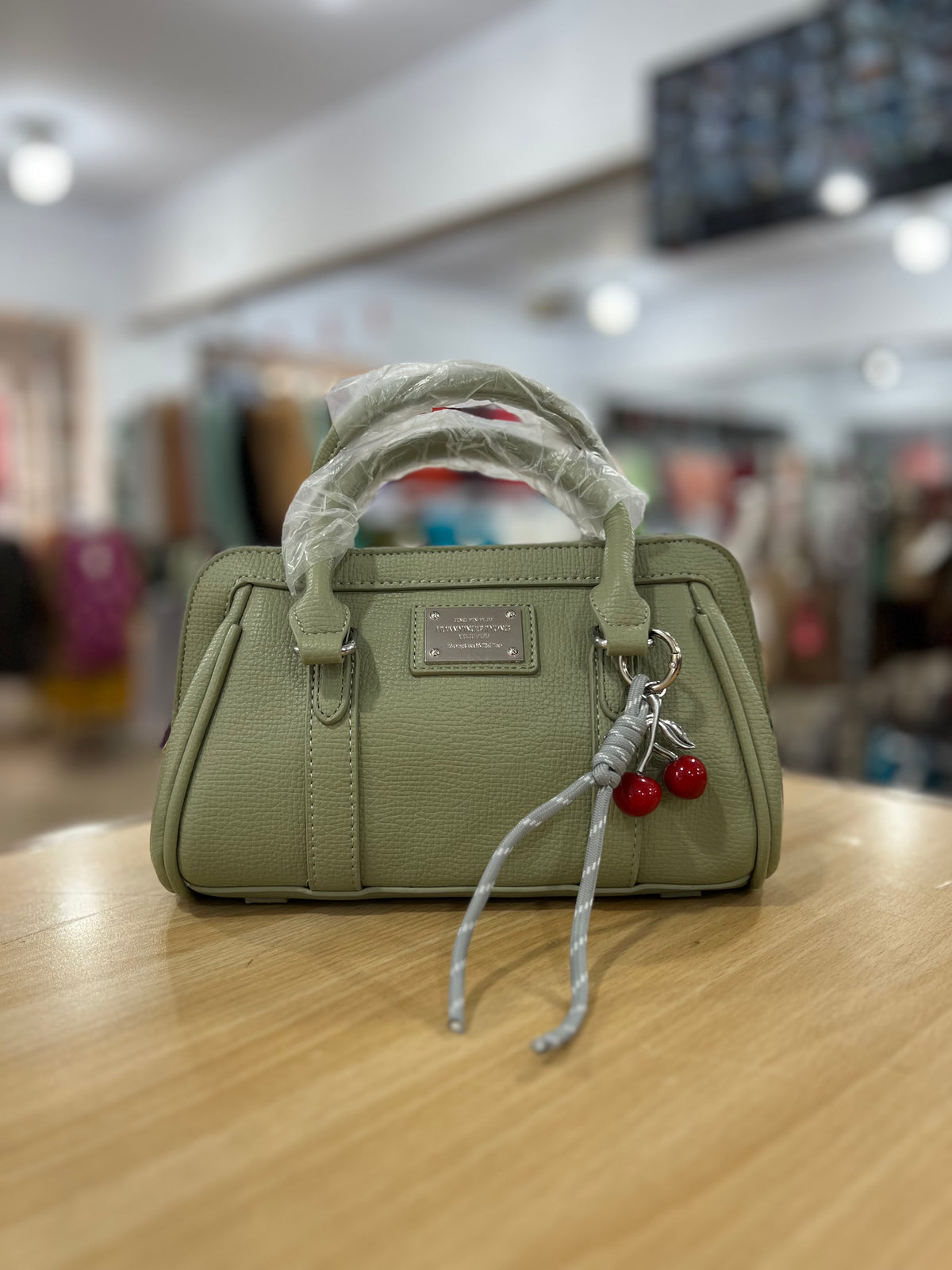 Elegant Mini Crossbody Bag with Cherry Keychain