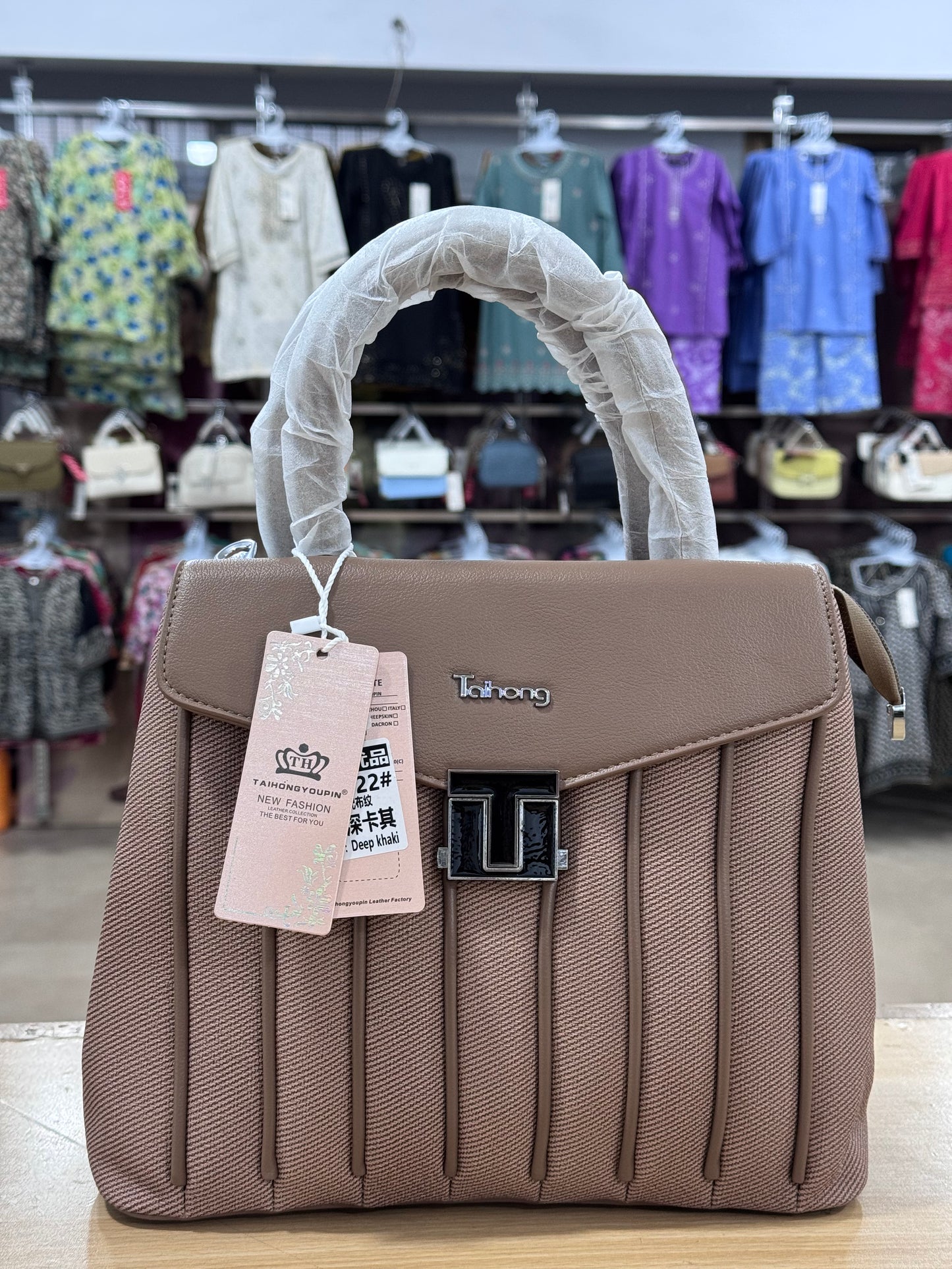 Elegant Structured Handbag with Adjustable Long Shoulder Strap