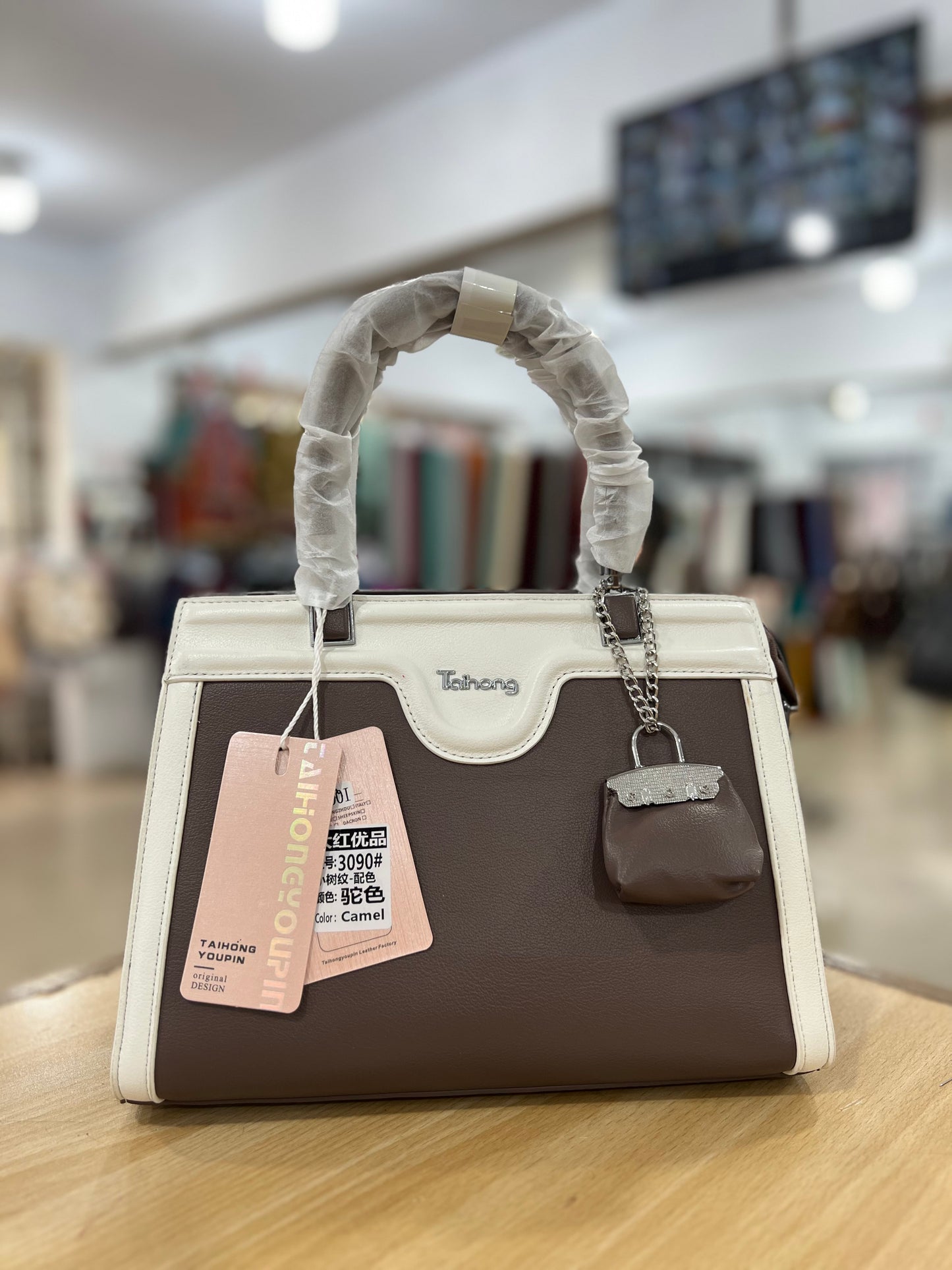 Elegant Two-Tone Handbag with Mini Bag Charm & Long Belt