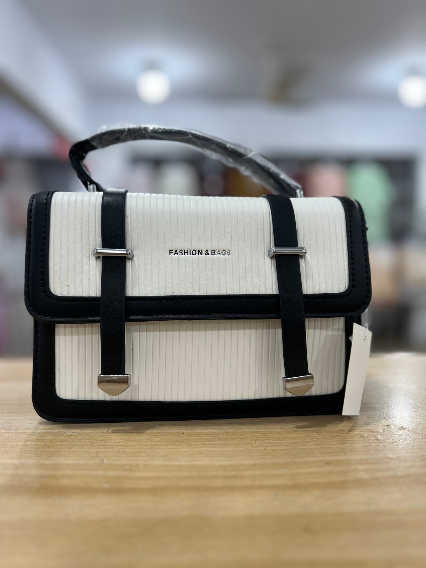 Elegant Structured Handbag with Long Belt