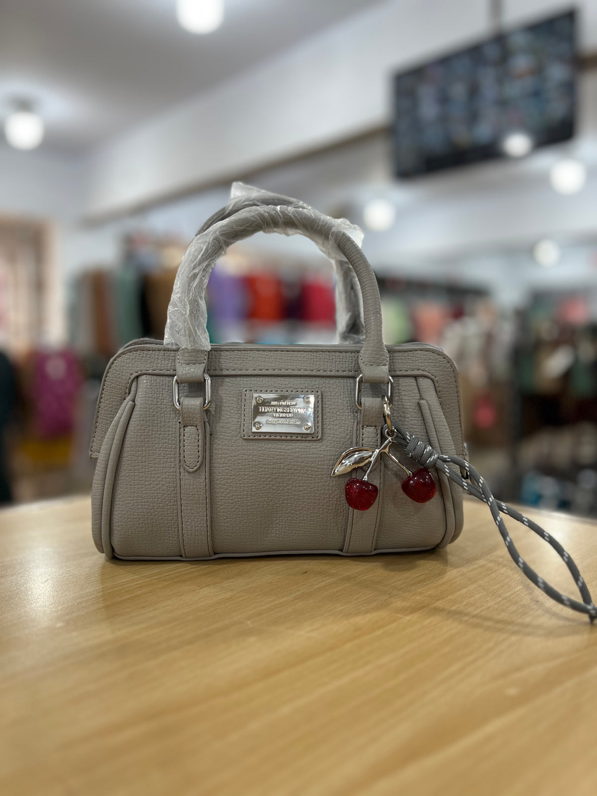 Elegant Mini Crossbody Bag with Cherry Keychain