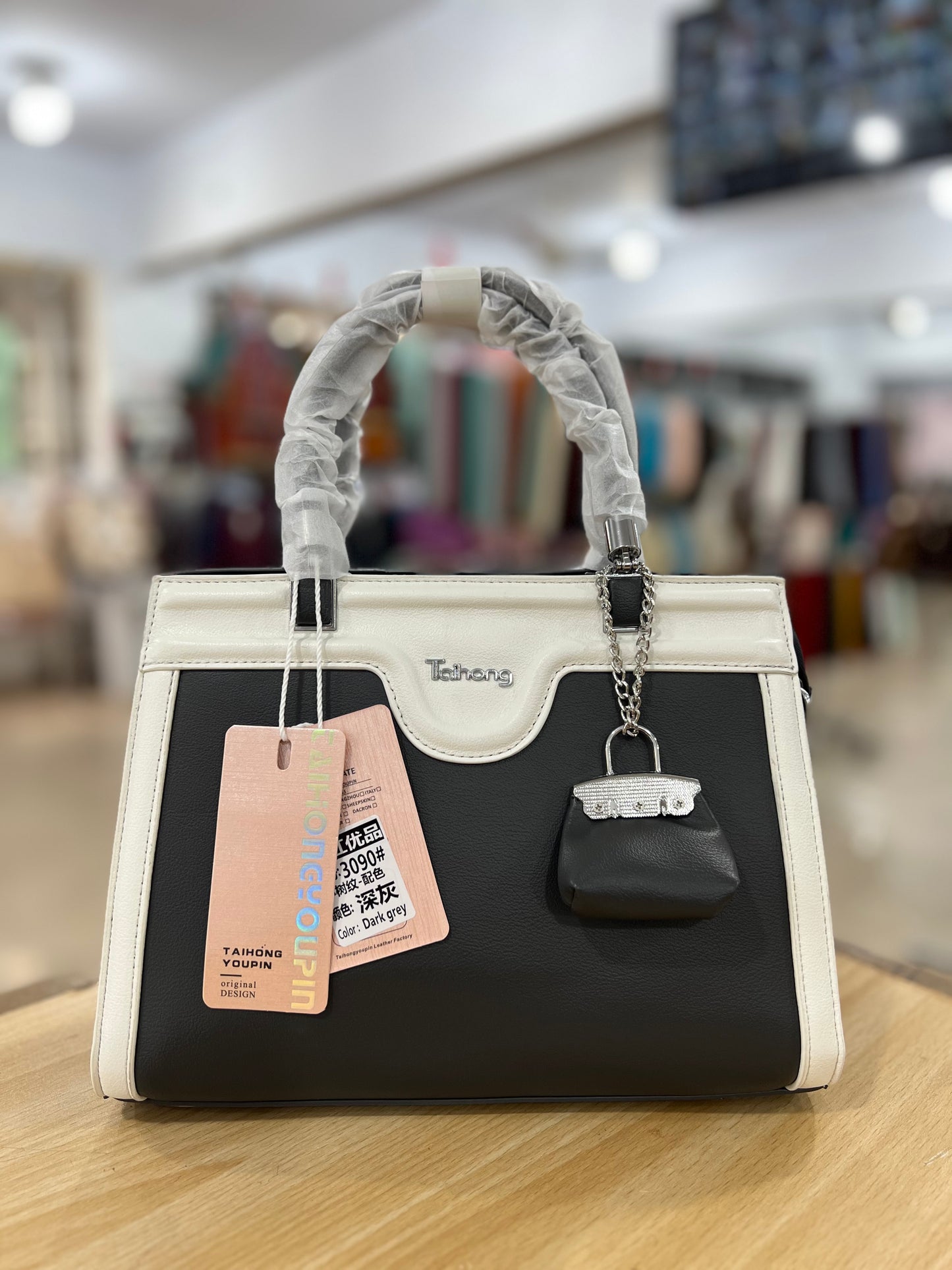 Elegant Two-Tone Handbag with Mini Bag Charm & Long Belt