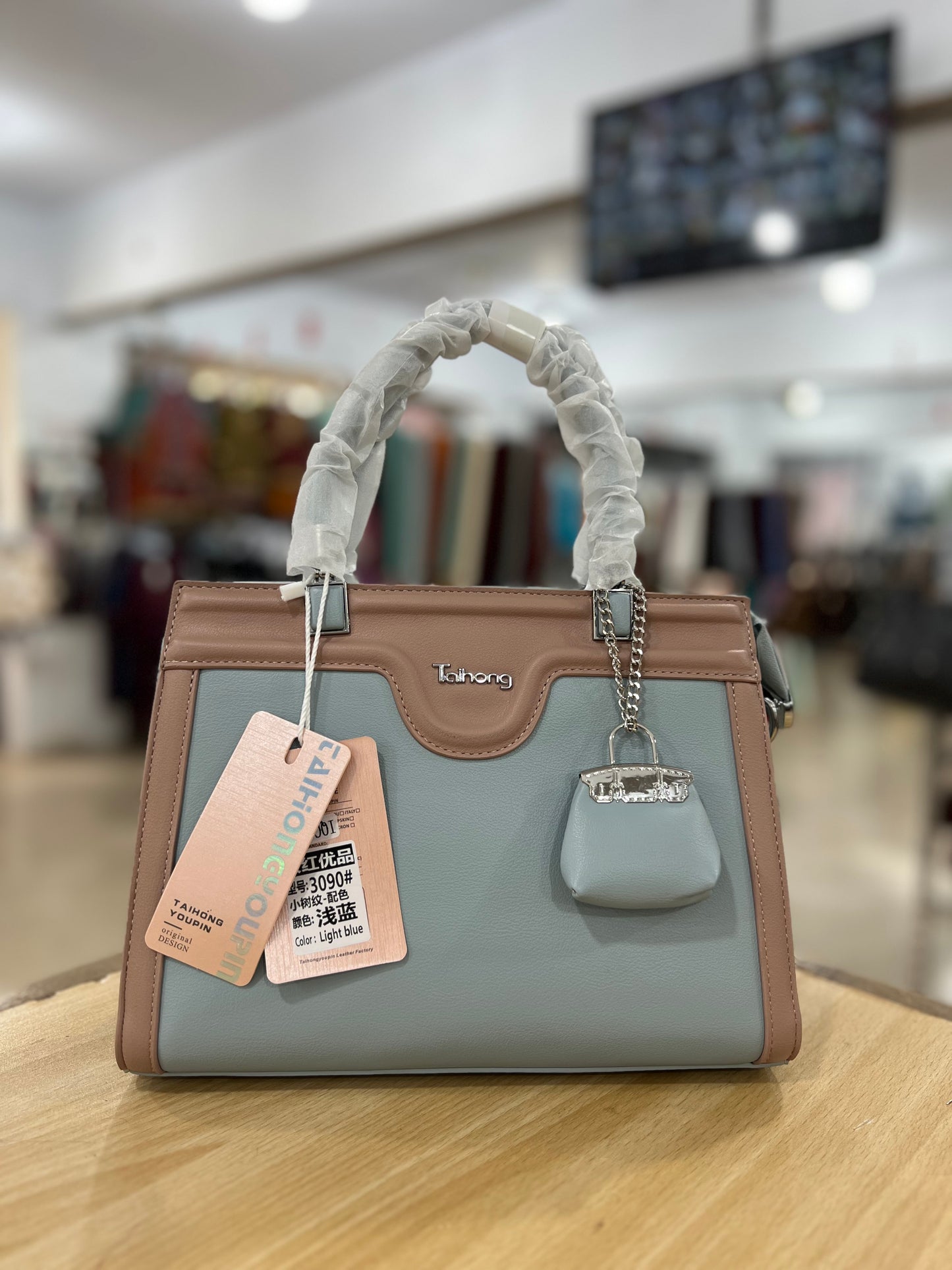 Elegant Two-Tone Handbag with Mini Bag Charm & Long Belt